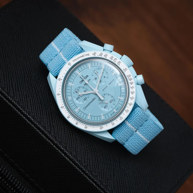 حزام ساعة اوميغا ازرق فاتح و ابيض